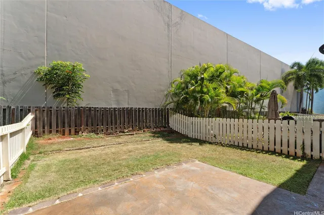 a backyard of a house with lots of green space and trees