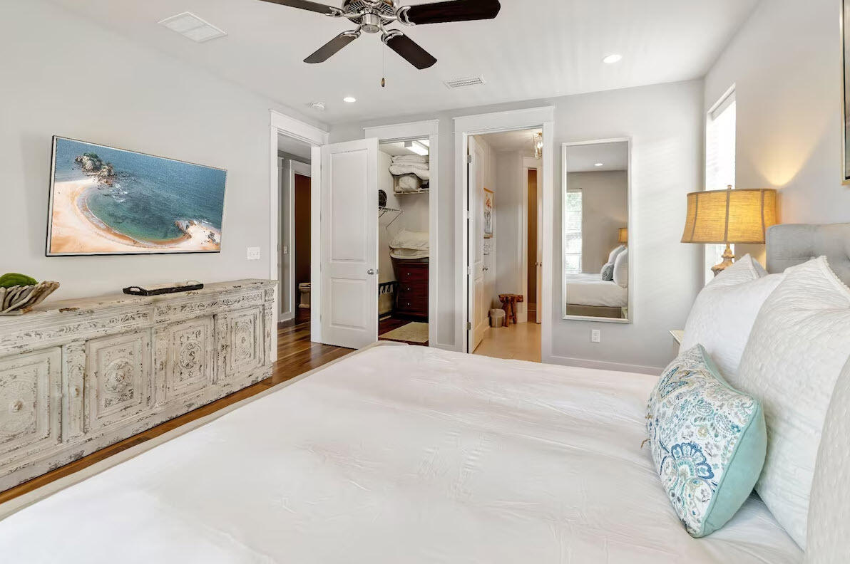 12 Cypress Circle Santa Rosa Beach, FL 32459 - Photo 29 of 33 a spacious bedroom with a bed and a flat screen tv