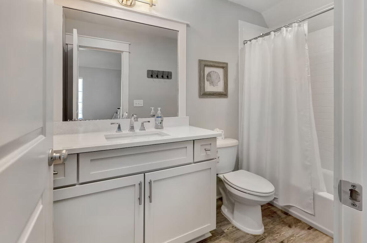 12 Cypress Circle Santa Rosa Beach, FL 32459 - Photo 3 of 33 a bathroom with a sink a toilet and shower