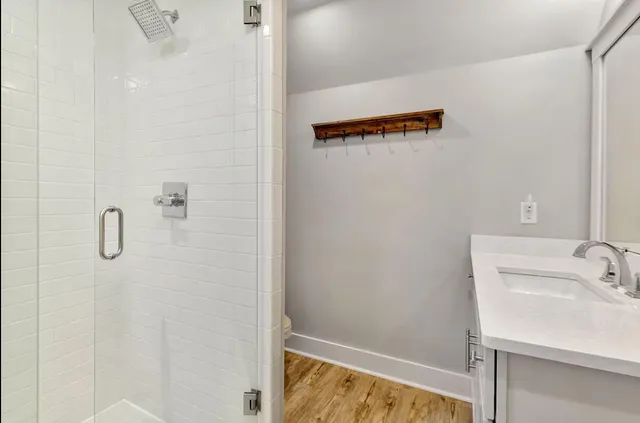 a bathroom with a sink and shower
