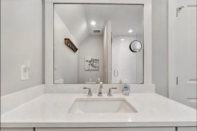 a bathroom with a bathtub and a sink