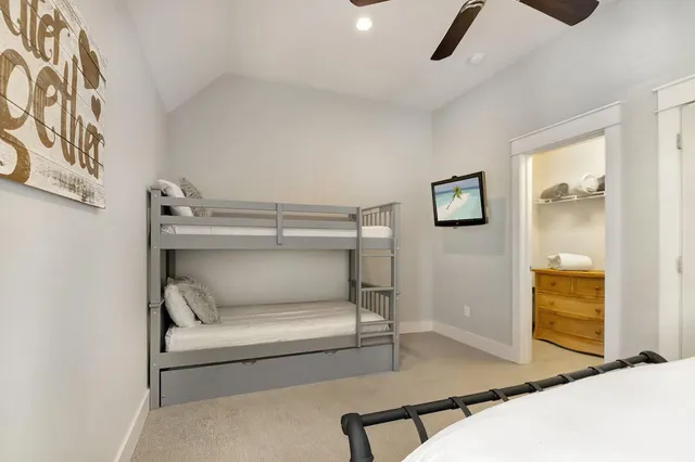 a bedroom with a bed and glass door