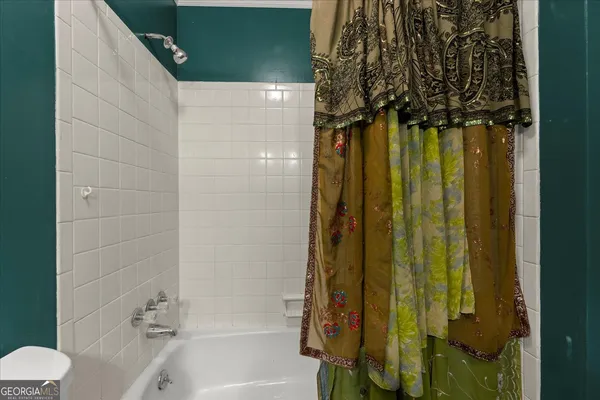 a bathroom with a shower and a tub