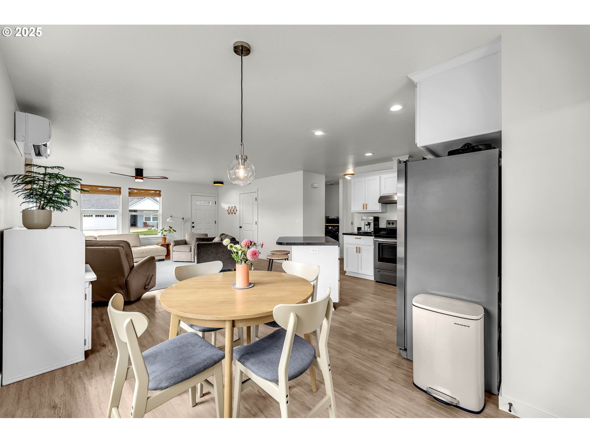 502 Cardinal Avenue Winlock, WA 98596 - Photo 12 of 33 a kitchen with a dining table chairs and refrigerator