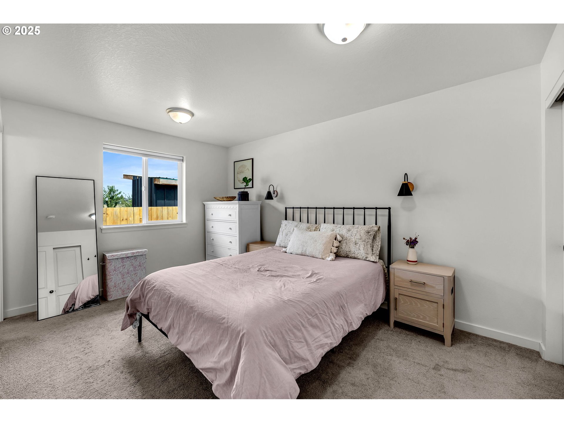 502 Cardinal Avenue Winlock, WA 98596 - Photo 15 of 33 a bedroom with a bed a mirror on dresser and a window