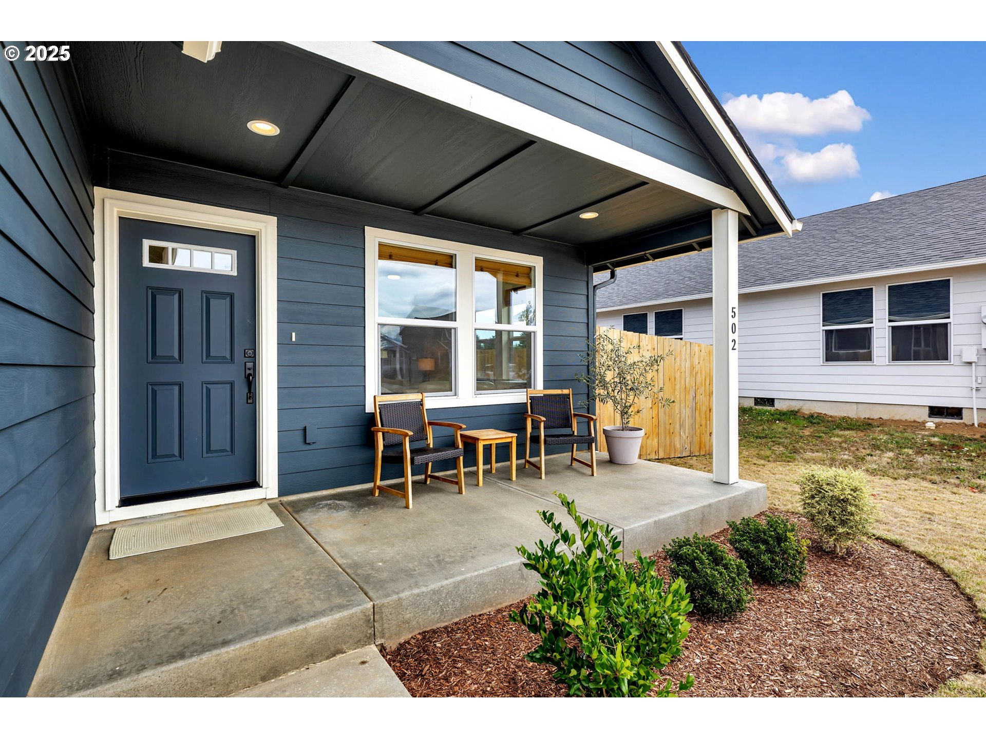 502 Cardinal Avenue Winlock, WA 98596 - Photo 2 of 33 a view of a porch with chairs and backyard