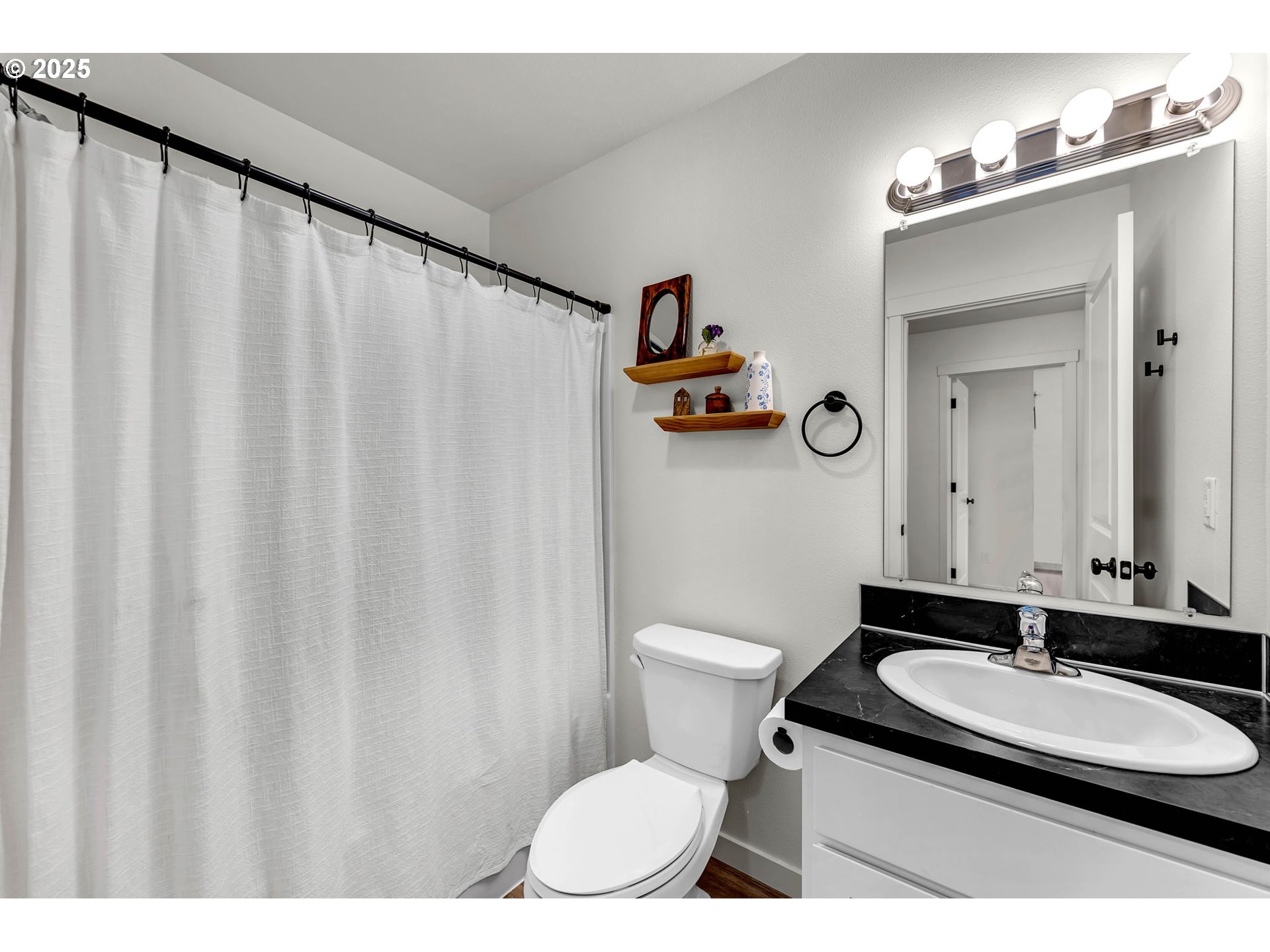 502 Cardinal Avenue Winlock, WA 98596 - Photo 21 of 33 a bathroom with a granite countertop sink and a mirror