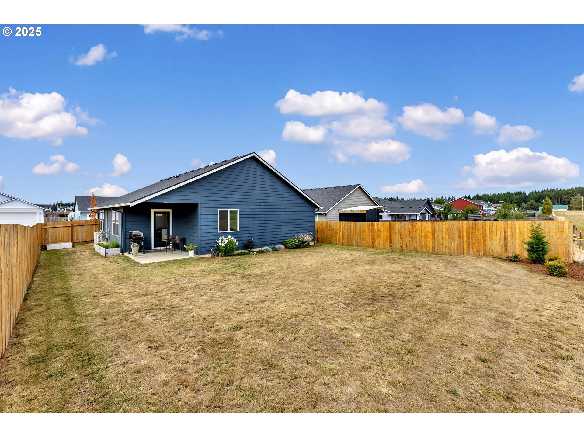 502 Cardinal Avenue Winlock, WA 98596 - Photo 29 of 33 a view of a house with backyard and garden
