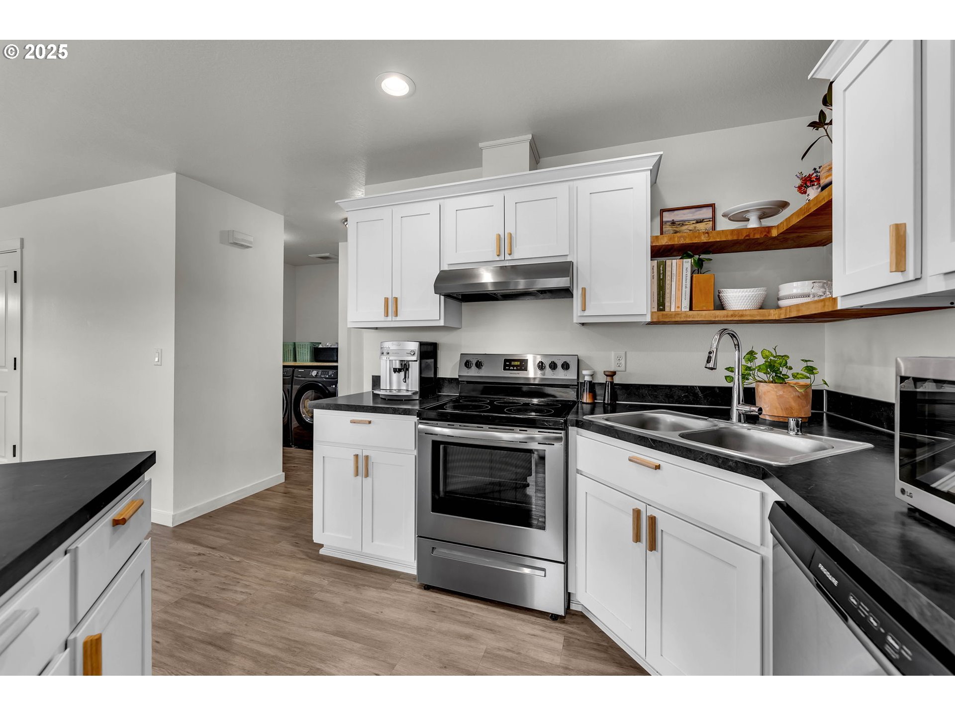 502 Cardinal Avenue Winlock, WA 98596 - Photo 7 of 33 a kitchen with cabinets stainless steel appliances and wooden floor
