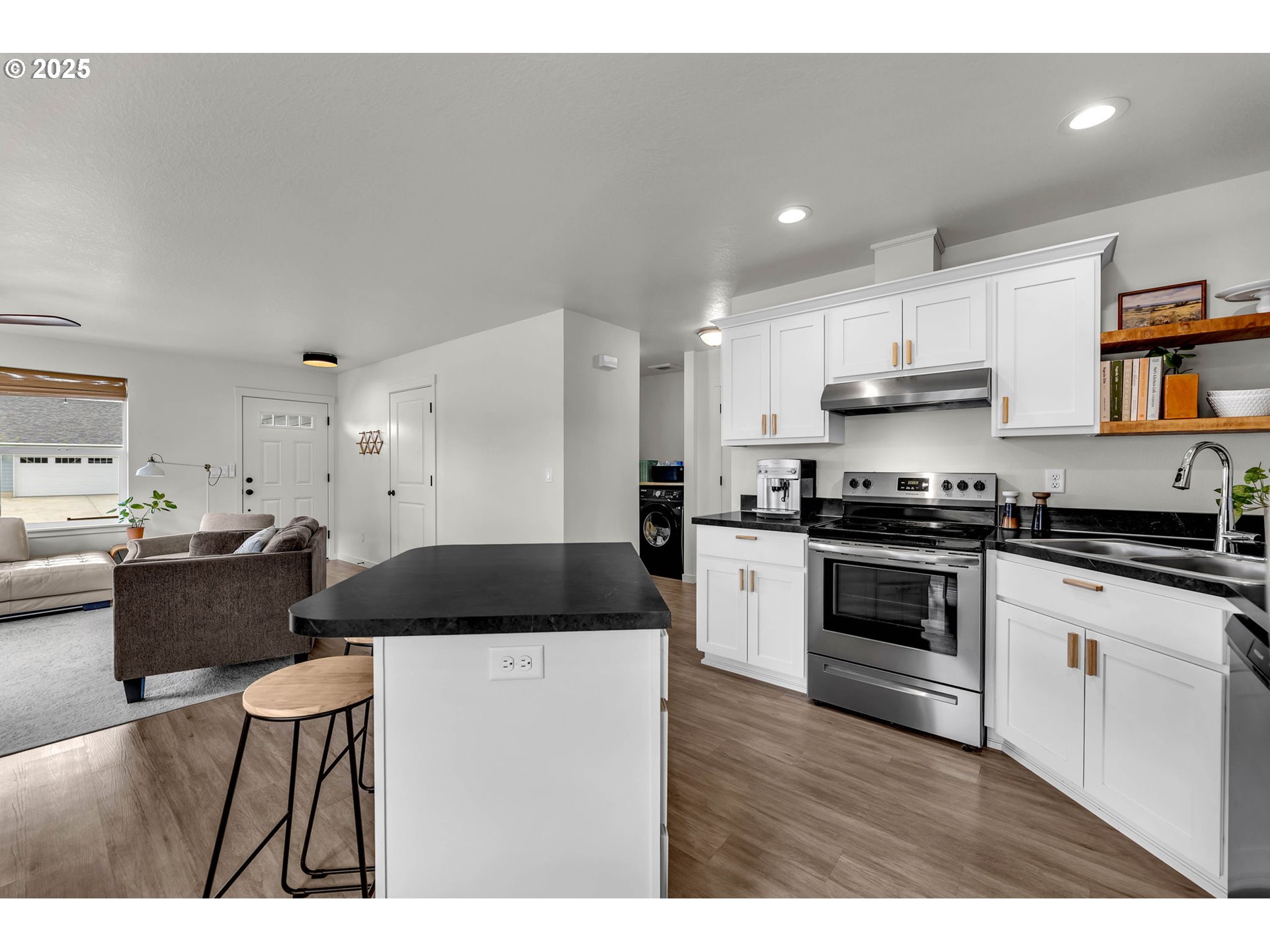 502 Cardinal Avenue Winlock, WA 98596 - Photo 9 of 33 a kitchen with granite countertop a sink cabinets and stainless steel appliances