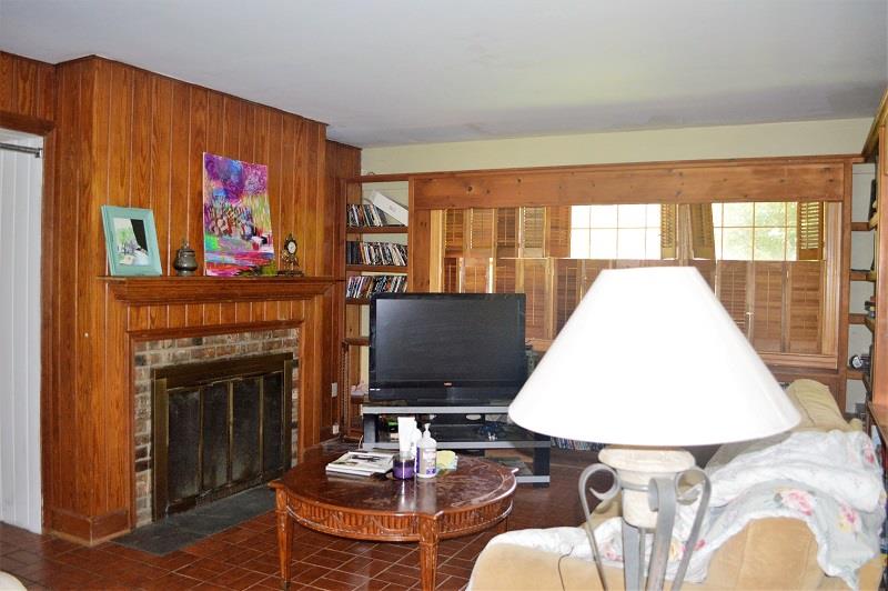 242 Shadowbrook Road Winchester, TN 37398 - Photo 14 of 30 There is a beautiful fireplace with real wood paneling in the den.