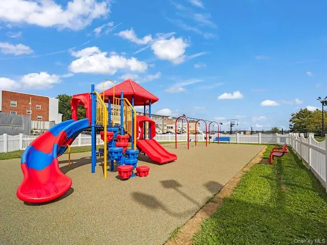 a view of play ground with swimming pool