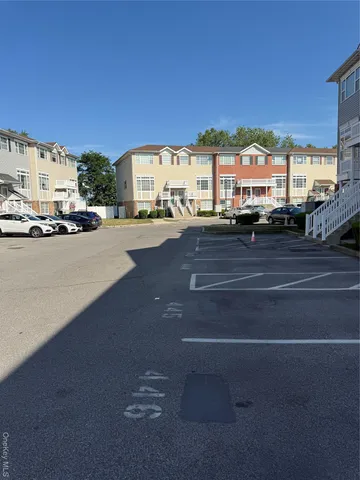 a view of a city street with cars