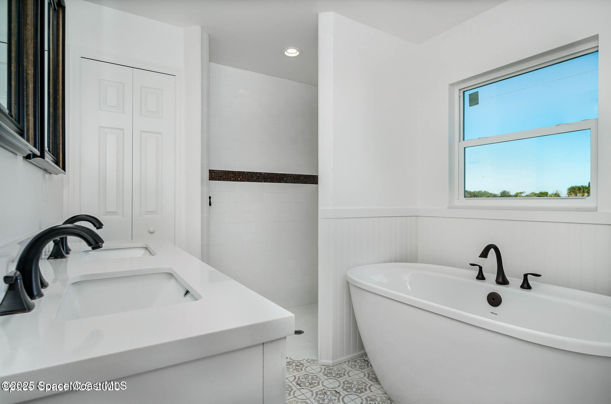1837 Ardmore Street Northeast Palm Bay, FL 32907 - Photo 15 of 23 a bathroom with a sink and a mirror