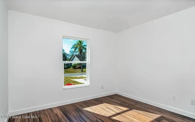 a view of an empty room and window