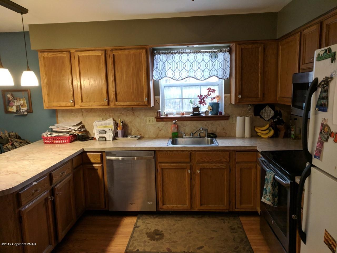 2159 Hill Road Effort, PA 18330 - Photo 3 of 19 a kitchen with stainless steel appliances a sink stove and cabinets