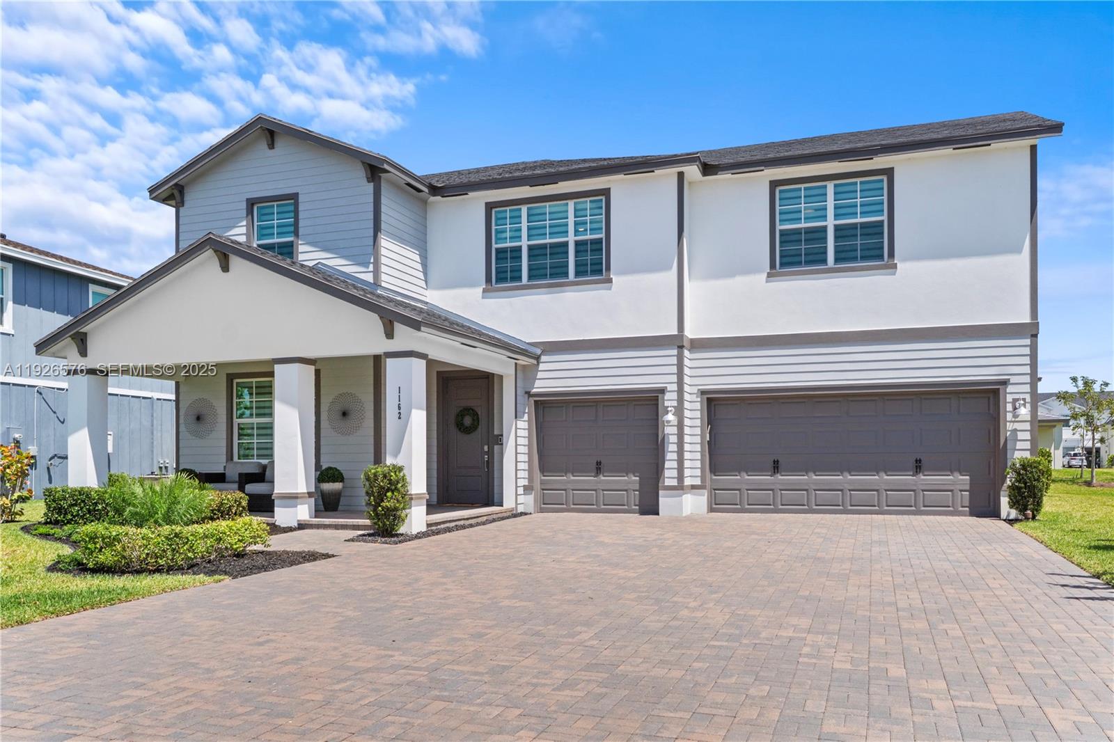 1162 Haywagon Trail Loxahatchee, FL 33470 - Photo 1 of 48 front view of a house with a yard