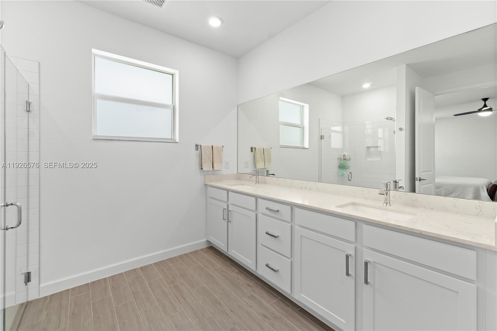 1162 Haywagon Trail Loxahatchee, FL 33470 - Photo 26 of 48 a bathroom with a granite countertop sink mirror and double