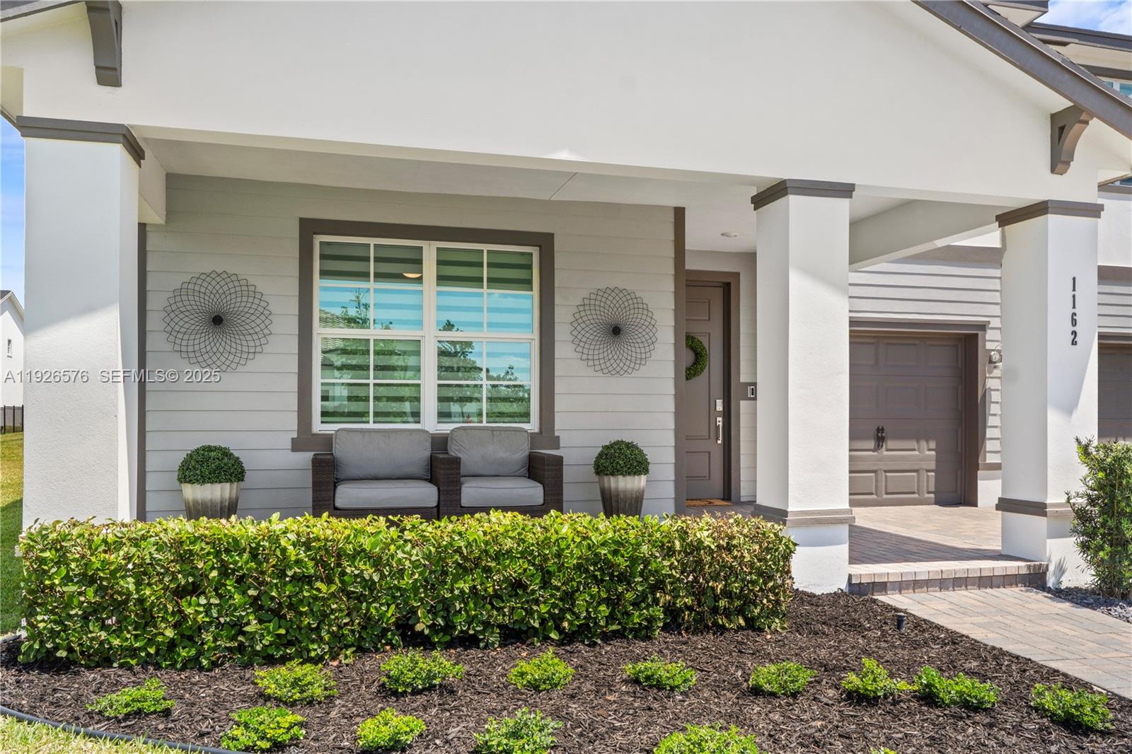 1162 Haywagon Trail Loxahatchee, FL 33470 - Photo 5 of 48 a view of house with backyard and outdoor seating