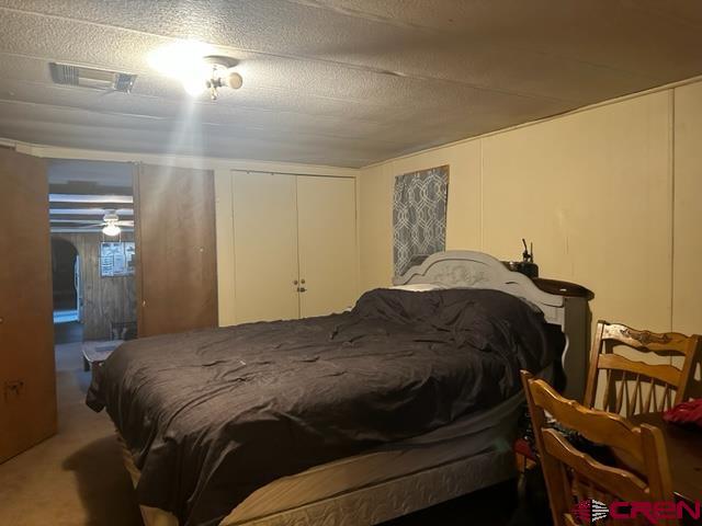 24020 Rd F 5, Unit 5 Cortez, CO 81321 - Photo 6 of 15 a bedroom with a bed and a dresser