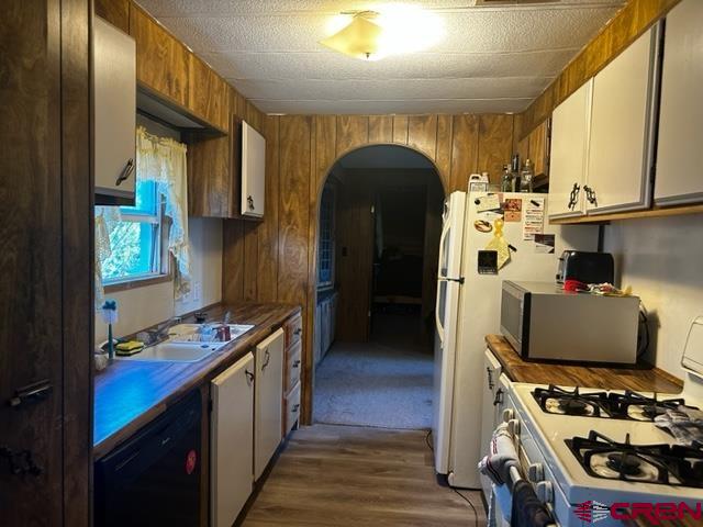 24020 Rd F 5, Unit 5 Cortez, CO 81321 - Photo 8 of 15 a kitchen with stainless steel appliances a stove a sink and a refrigerator