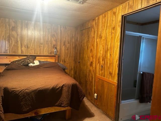 24020 Rd F 5, Unit 5 Cortez, CO 81321 - Photo 9 of 15 a bed sitting in a room next to a window