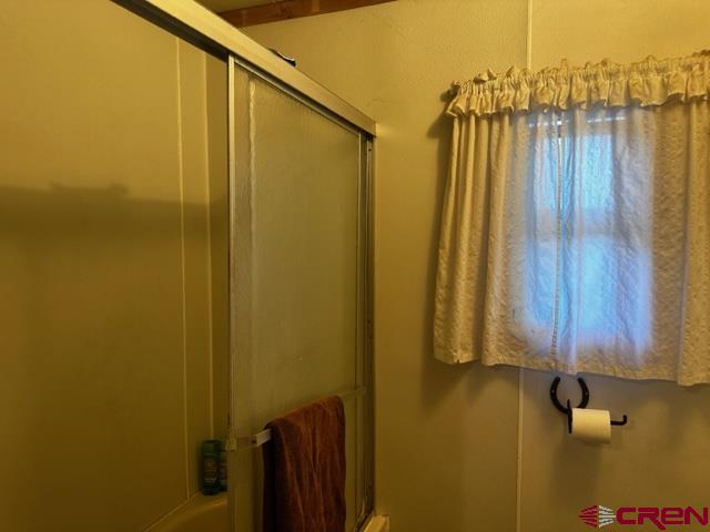 24020 Rd F 5, Unit 5 Cortez, CO 81321 - Photo 10 of 15 a bathroom with a shower
