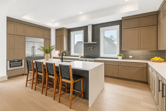 a bathroom with a double vanity sink a mirror and a shower