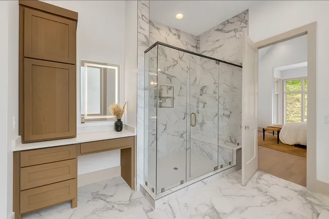 a front view of a house with a yard and trees