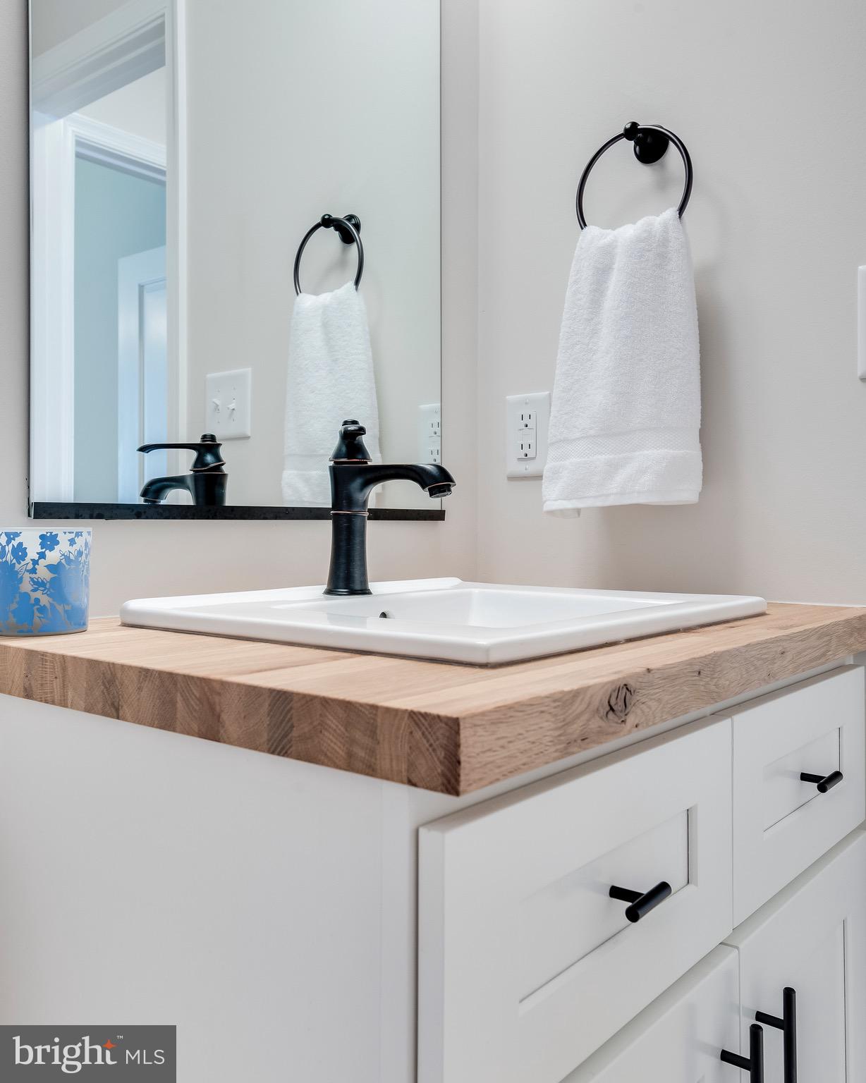 1724 Tacoma Road Edgewater, MD 21037 - Photo 43 of 81 a bathroom with a sink and a mirror