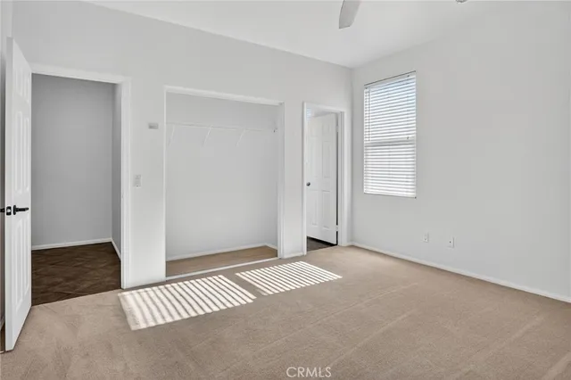 a white toilet sitting next to a bath tub and a shower