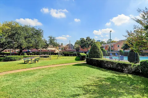 a view of a golf course with a house