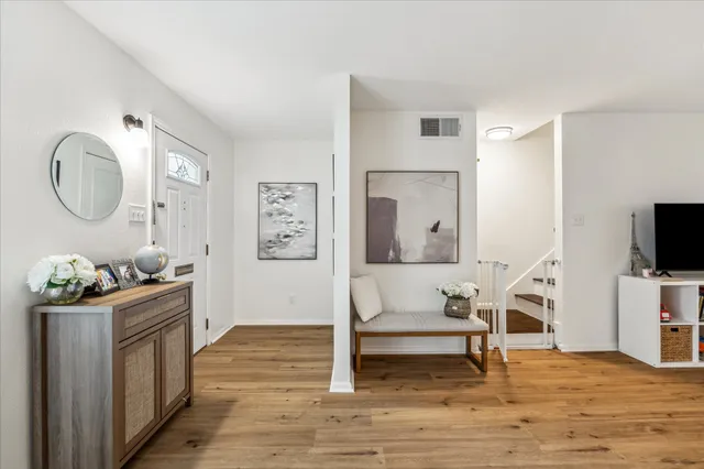 a very nice looking room with wooden floor