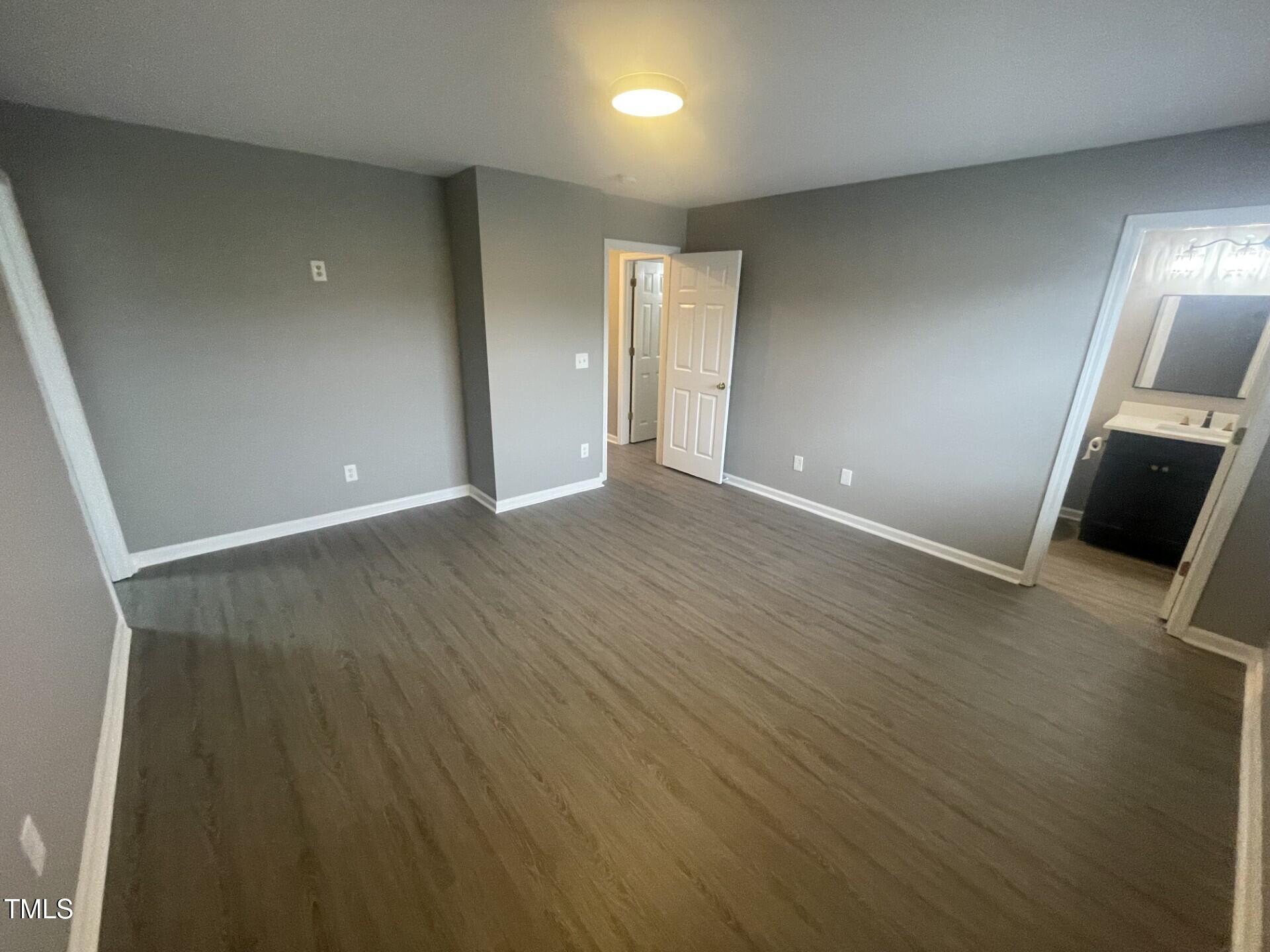 4201 Beacon Crest Way Raleigh, NC 27604 - Photo 18 of 21 wooden floor in an empty room with a window