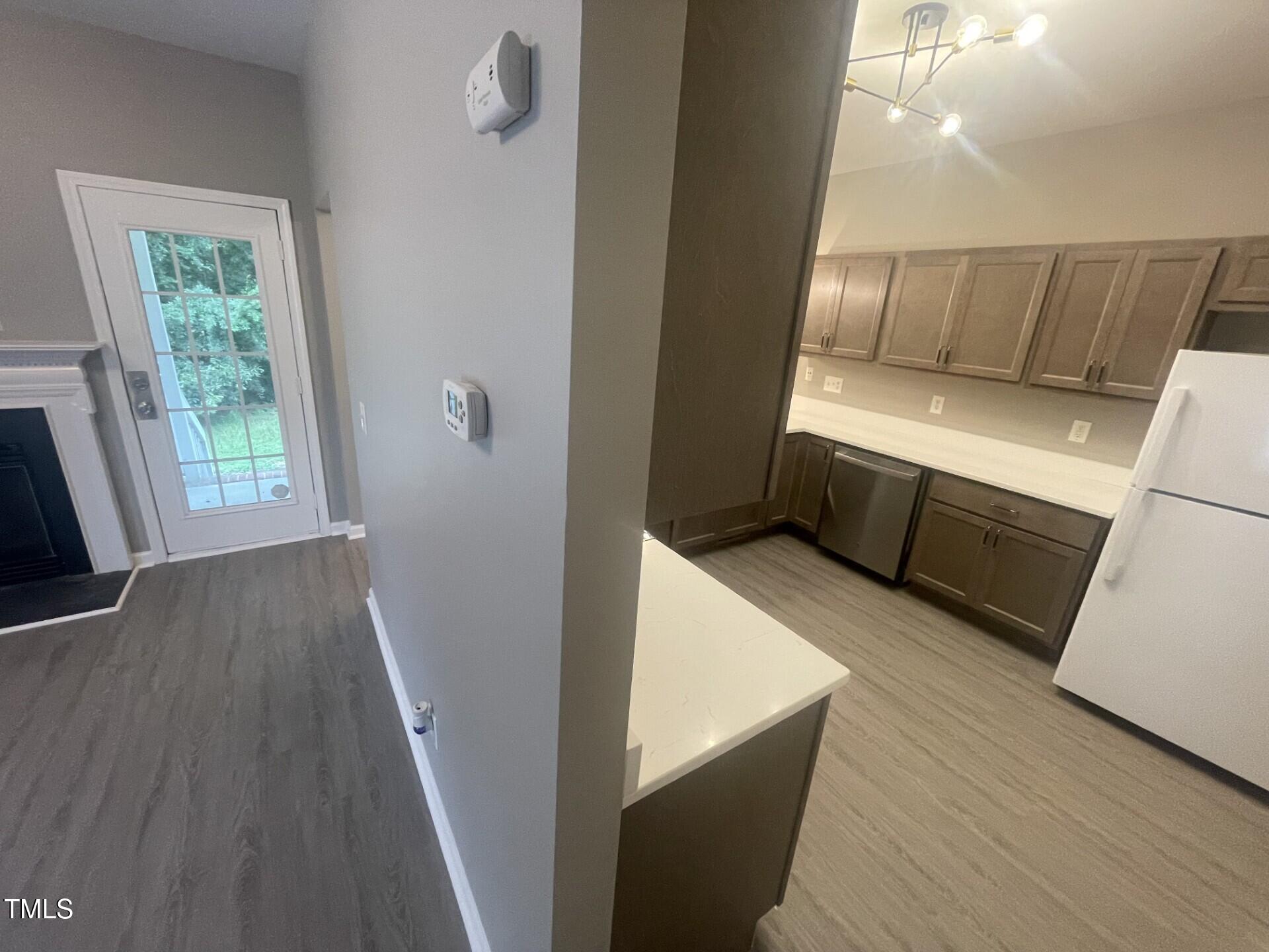 4201 Beacon Crest Way Raleigh, NC 27604 - Photo 10 of 21 a view of washer and dryer with wooden floor
