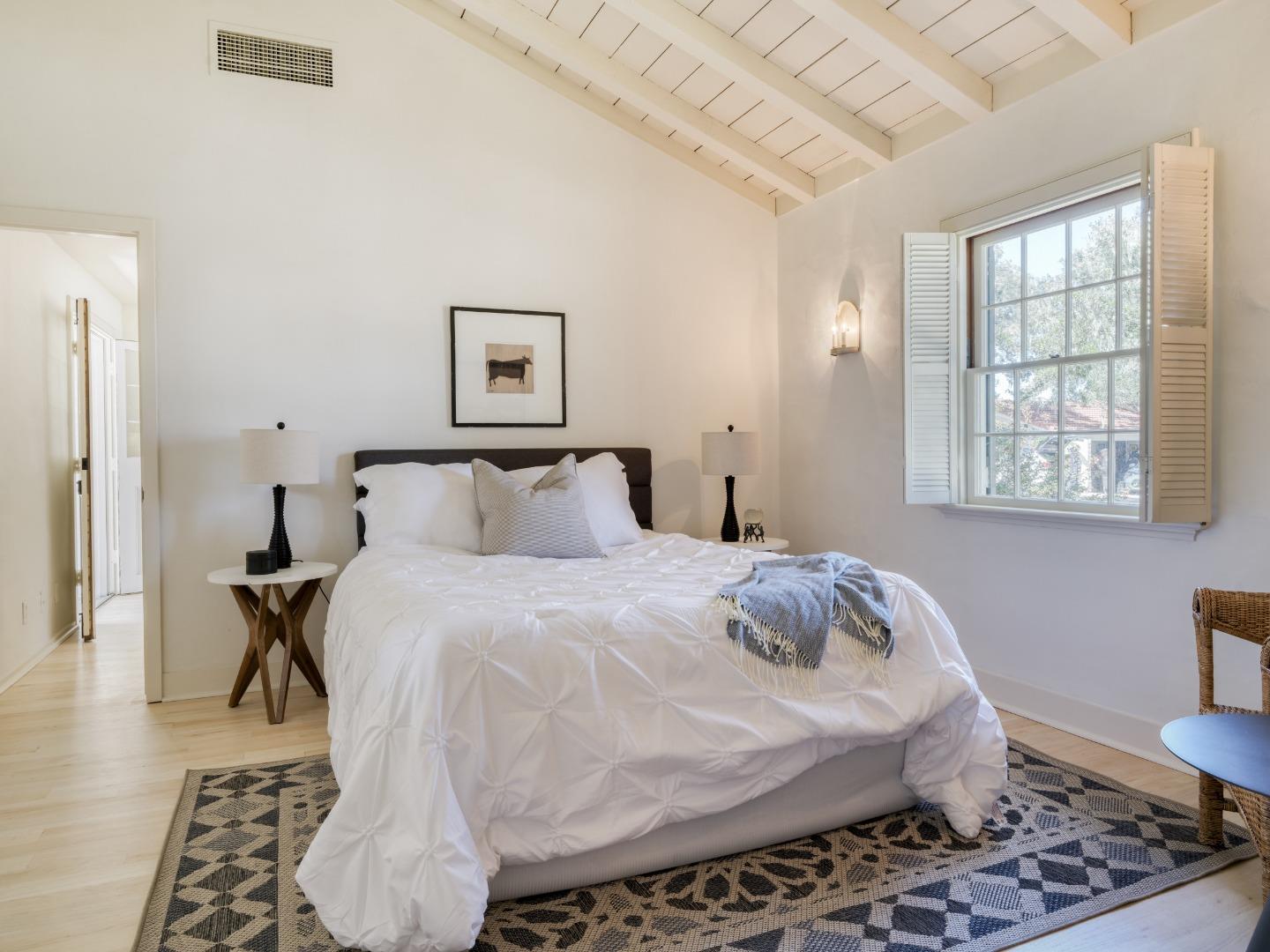 150 Littlefield Road Monterey, CA 93940 - Photo 20 of 51 a bedroom with a bed and wooden floor