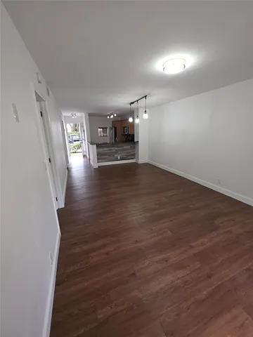 a view of a livingroom with wooden floor