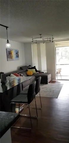 a kitchen with a table chairs and a stove
