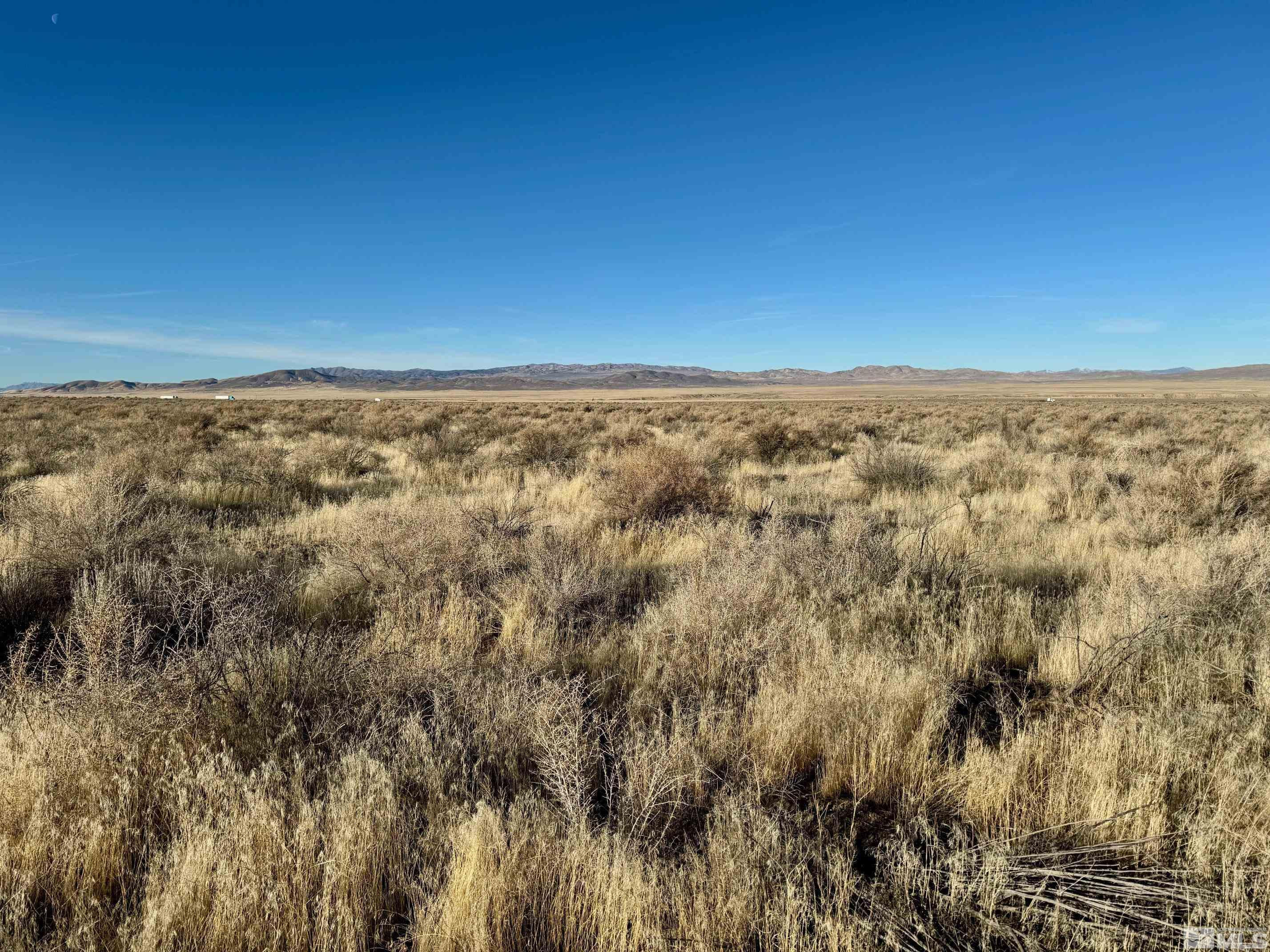 21865 Chimney Creek Road, Unit 6 Lovelock, NV 89419 - Photo 11 of 28 an aerial view of house with yard and mountain view in back