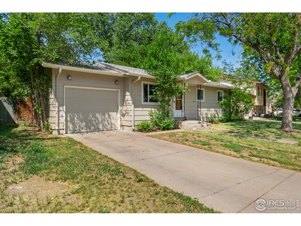 1803 30th Street Road Greeley, CO 80631 - Photo 1 of 10 Front of Home, Side view with Attached Garage