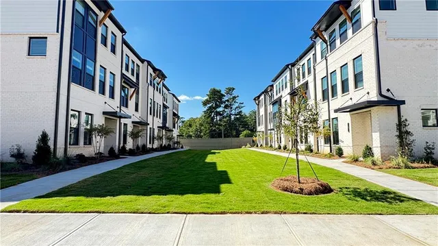 a balcony with trees in front of it