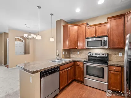 a kitchen with a stove and a microwave