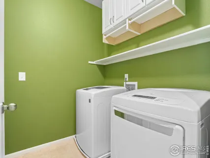 a view of a room with stairs and a white door