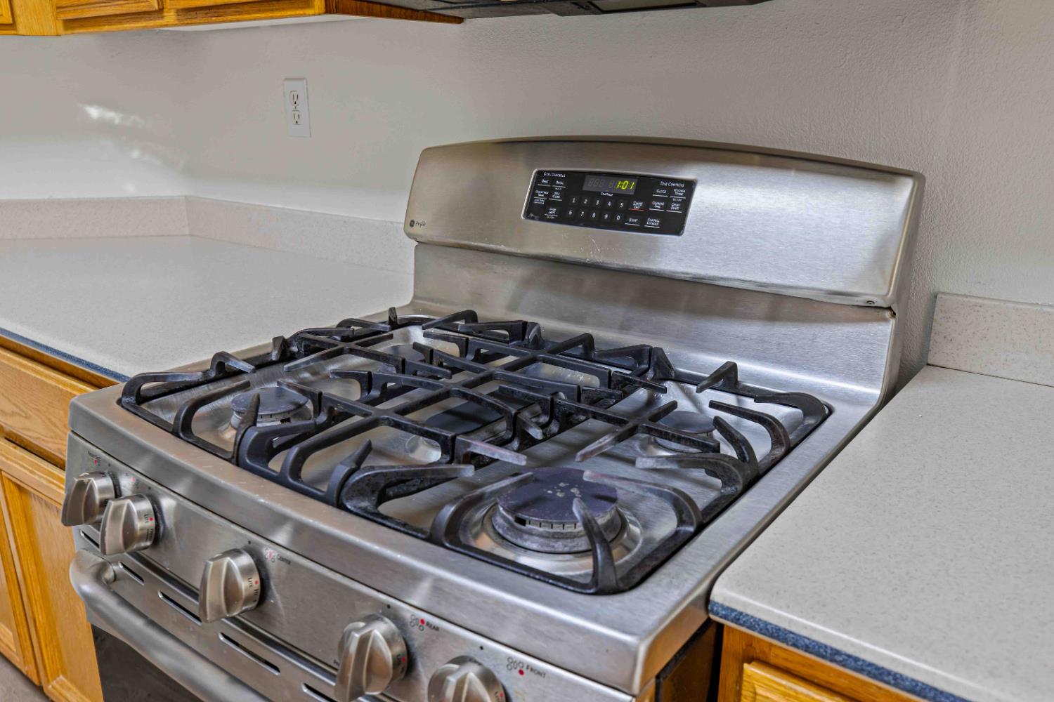 995 West Springer Drive Turlock, CA 95382 - Photo 13 of 39 a close up of a stove sitting inside of a kitchen