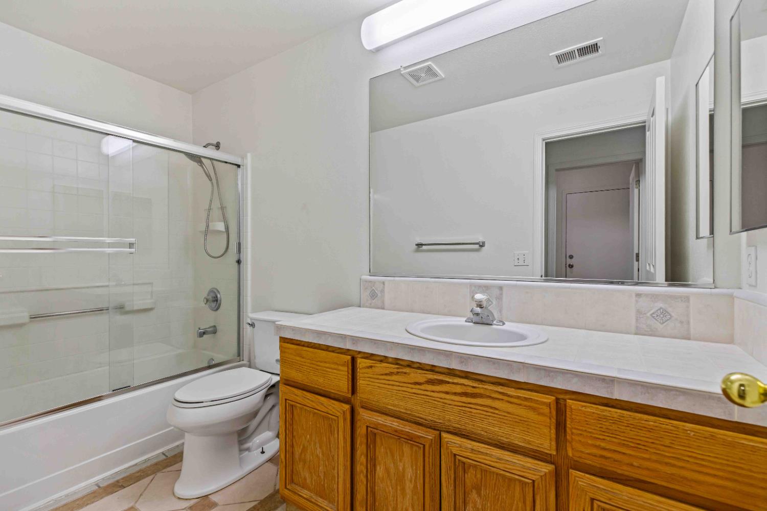 995 West Springer Drive Turlock, CA 95382 - Photo 18 of 39 a bathroom with a sink a toilet and shower