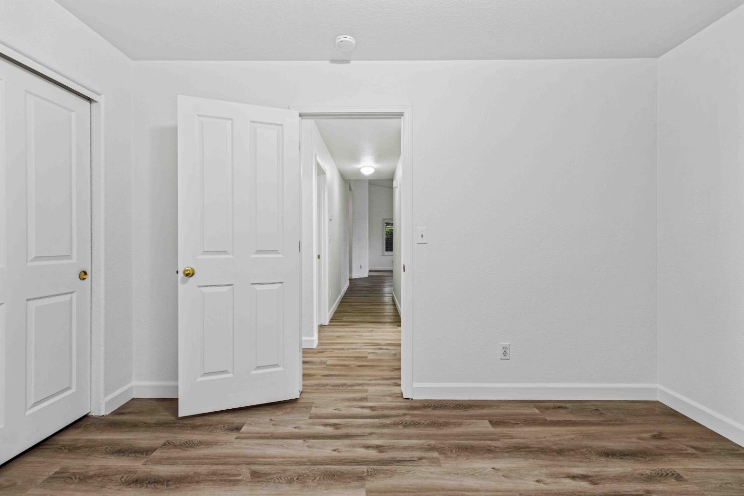 995 West Springer Drive Turlock, CA 95382 - Photo 21 of 39 a view of a room with wooden floor