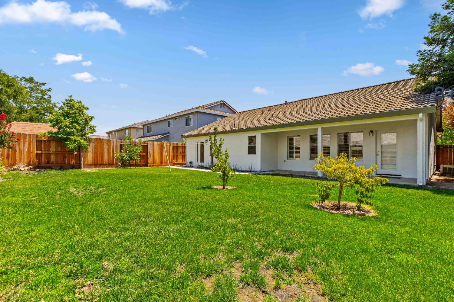 995 West Springer Drive Turlock, CA 95382 - Photo 32 of 39 a view of a house with a backyard