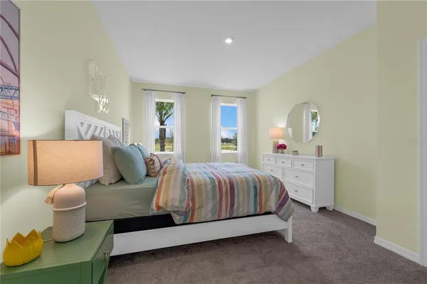 a spacious bedroom with a bed and window