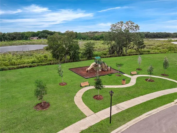 a view of a table and chairs in the garden