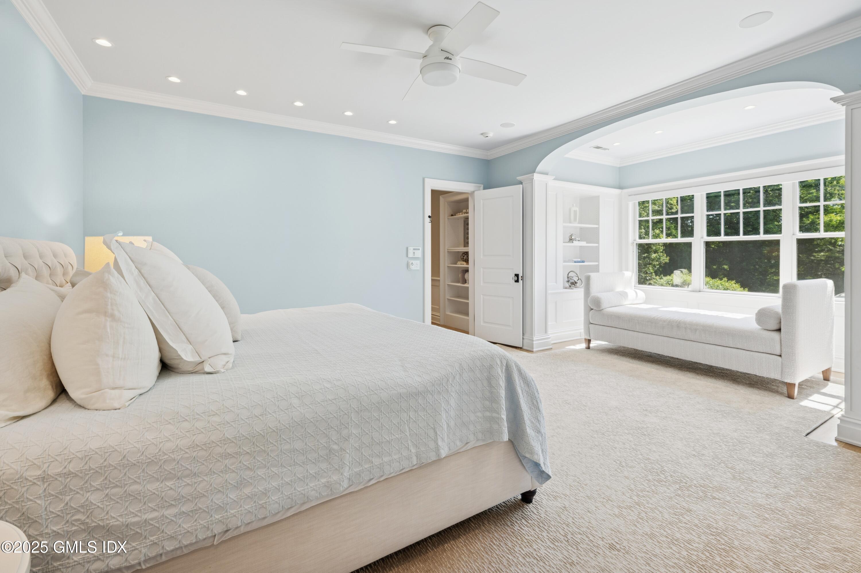 2 Sparrow Lane Greenwich, CT 06830 - Photo 14 of 28 a spacious bedroom with a bed and a couch
